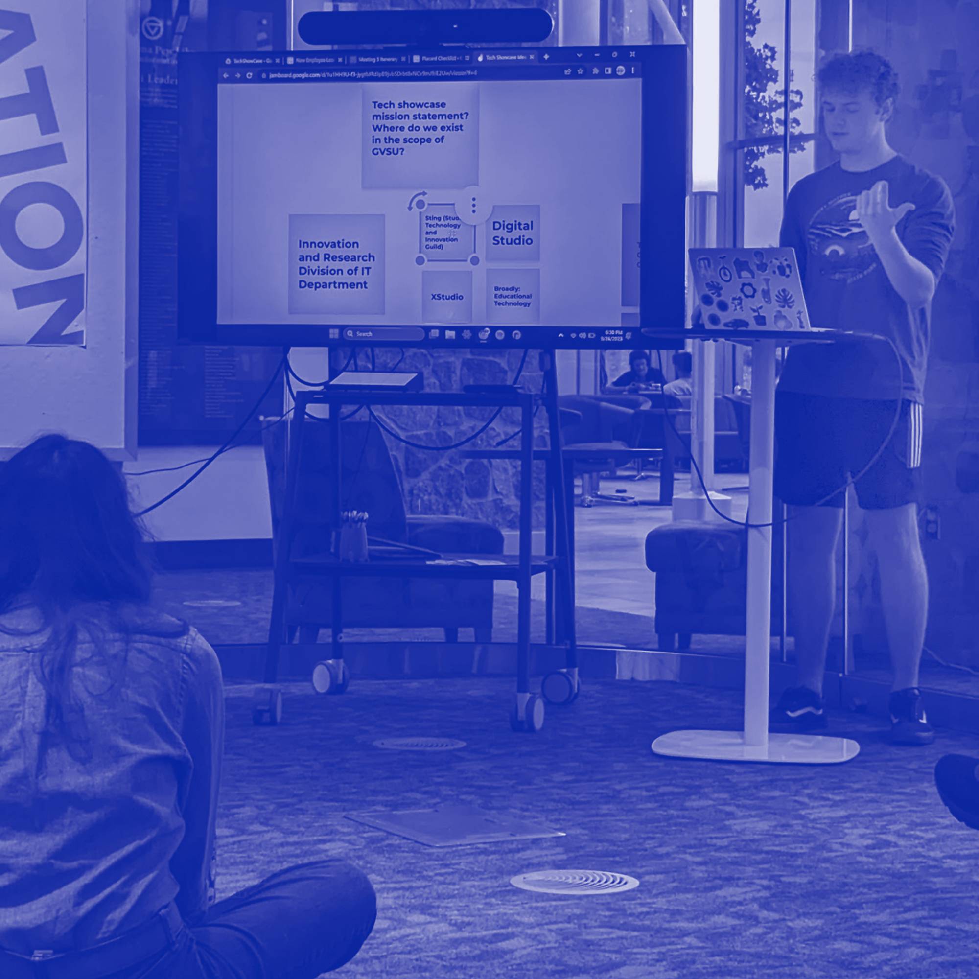 A student presents ideas in the technology showcase.